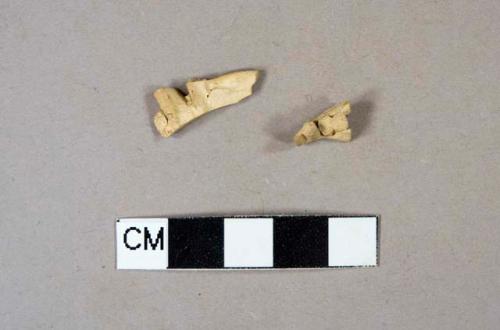 Highly fired ceramic object sherds, appears to be made into a woven pattern; two sherds crossmend