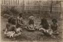 Fijians sitting outside making kava