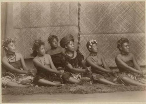 Row of seated women dancing