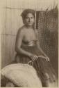 Staged portrait of woman with fishing basket