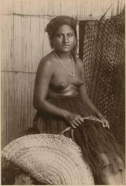 Staged portrait of woman with fishing basket