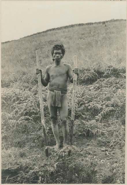 Igorot man turning sod