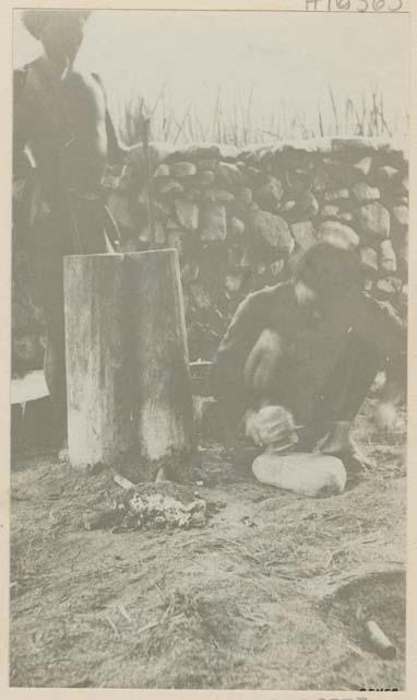 Two blacksmiths working