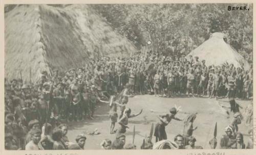 Crowds and dancing at large harvest festival in pueblo of Guhang. Ifugao