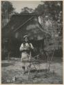 Igorot girl reeling yarn. Taken at the St. Louis Exposition, 1904