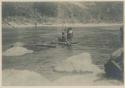 Ifugao men crossing river on raft