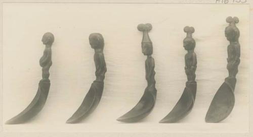 Five carved wooden spoons, side