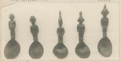 Five carved wooden spoons