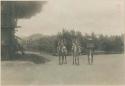 Three Igorot men, two on horseback