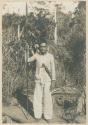 Bukidnon man posing with lance and bolo at Libaca