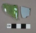 Green bottle glass fragments, one has milk glass face