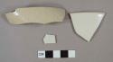 White salt glazed stoneware rim and body sherds; one has incised lines