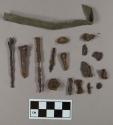 Unidentified nail fragments; white metal strip fragment