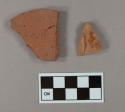 One brick fragment; one redware sherd with lead glaze