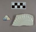 One blue shell edge pearlware rim sherd; one molded pearlware base sherd