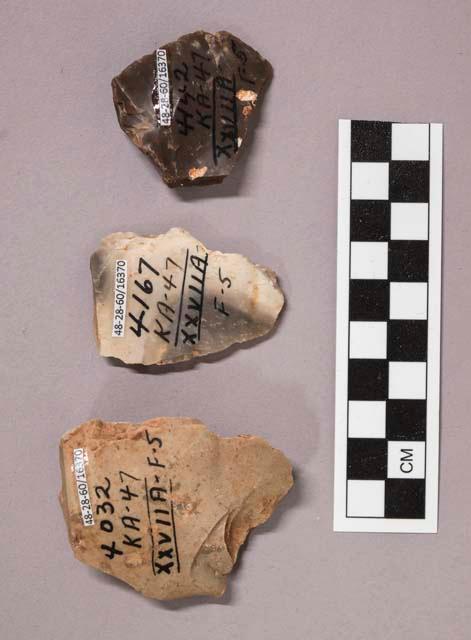 3 flint flakes, including tan, grey, cream and brown colored stone