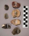 7 flint flakes, including tan, grey, brown and red colored stone