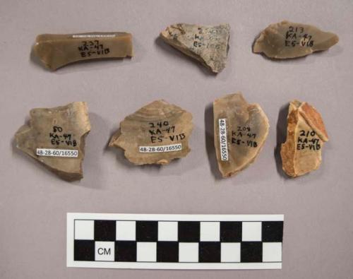 7 flint flakes, including grey and tan colored stone (some with cortex)