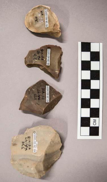 4 flint flakes, including brown, grey and tan colored stone (1 with cortex)