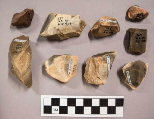 9 flint cores, including grey, cream and brown colored stone (some with cortex)