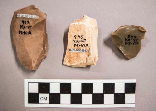 3 flint flakes, including brown and cream colored stone (with cortex)