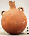 Flask shaped vessel of red ware
