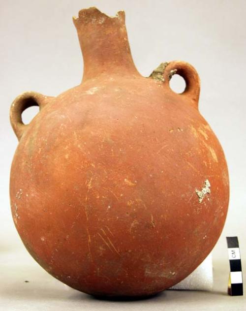 Flask shaped vessel of red ware