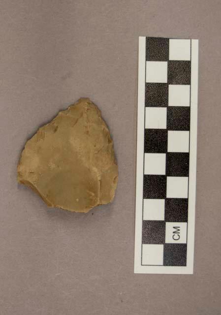 1 flint point, tan colored stone