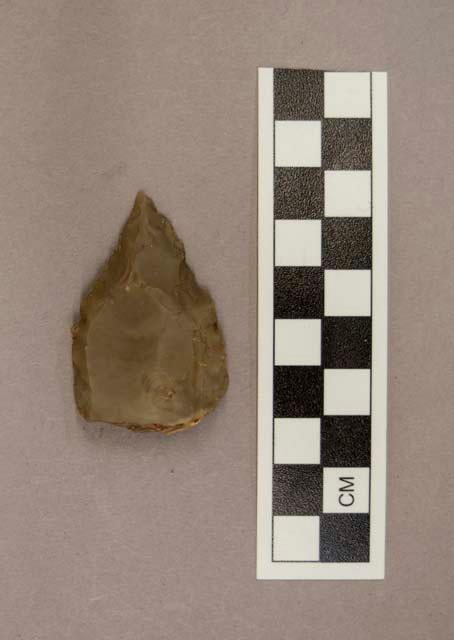 1 flint point, greyish tan colored stone