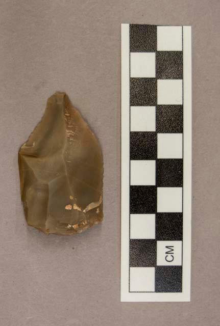 1 flint point, greyish tan colored stone