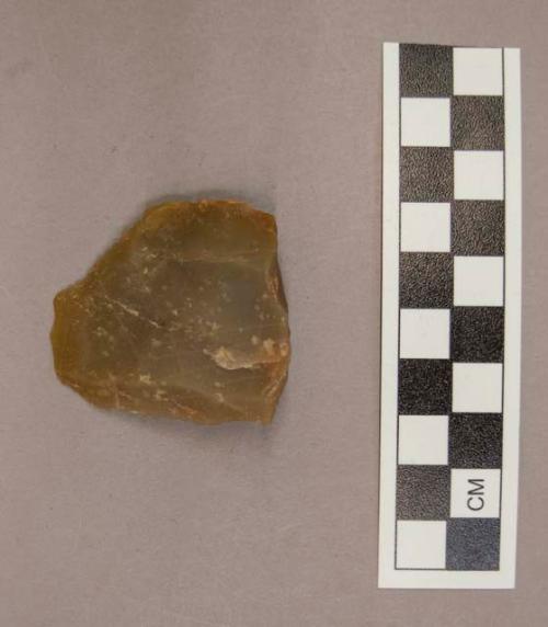 1 flint blade, greyish tan colored stone