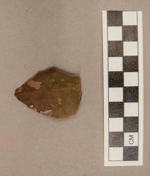 1 flint flake, reddish tan colored stone