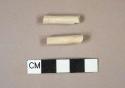 Unsmoked, undecorated pipe stem fragments, 6/64" bore diameter; both crossmend with mouthpiece fragment