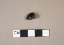 Black faceted glass button fragment