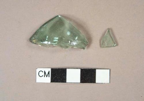 Aqua bottle glass fragments, one possible base fragment