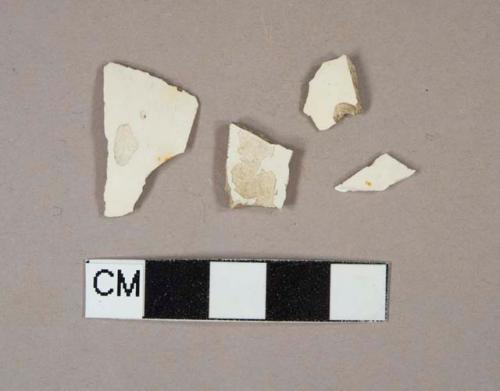 Undecorated creamware body sherds, two sherds crossmend