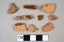 8 slip glazed redware fragments, 1 fragment with molded decoration, 1 red brick fragment