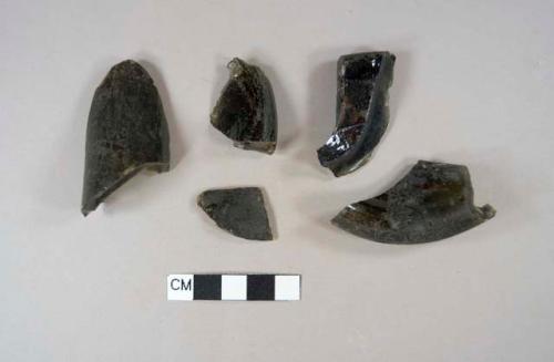 Hand blown olive green bottle glass fragments; three base fragments, one neck fragment