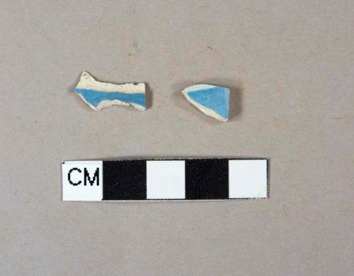 Factory decorated pearlware body sherds with blue slip and incised lines