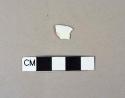 Molded, blue decorated pearlware body sherd; possible blue shell edge