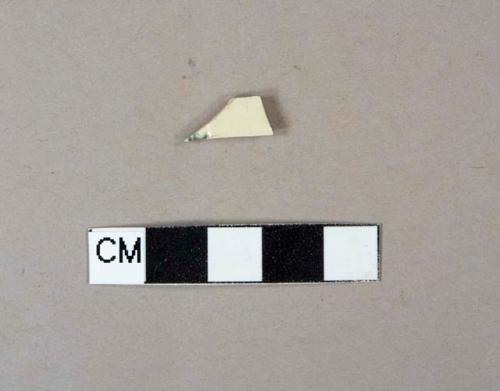 Creamware body sherd with incised decoration and blue glaze