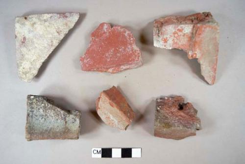 Red brick fragments, 1 slightly glazed, 1 with adhered mortar