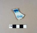 Blue hand painted porcelain rim sherd with brown glazed rim