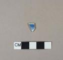 Blue hand painted porcelain rim sherd with brown glazed rim