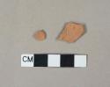 Redware body sherds, both finished surfaces missing