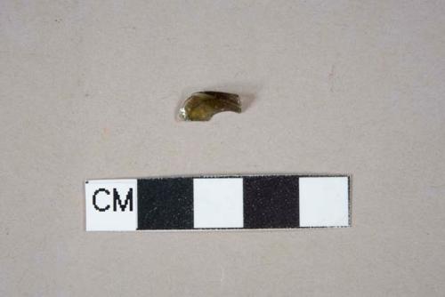 amber vessel glass fragment, portion indeterminate but likely body