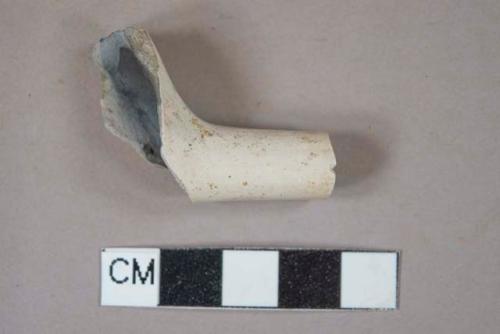 White kaolin pipe stem fragment with partial bowl attached, burned, undecorated