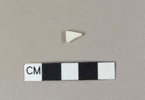 Undecorated cream-colored ironstone body sherd