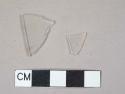 1 Colorless flat glass fragment, 1 colorless glass vessel body fragment