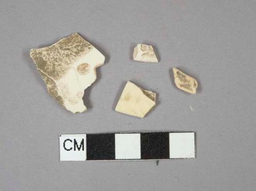2 Creamware vessel rim fragments, 1 Creamware body or base fragment,  1buff paste ceramic fragment, unglazed